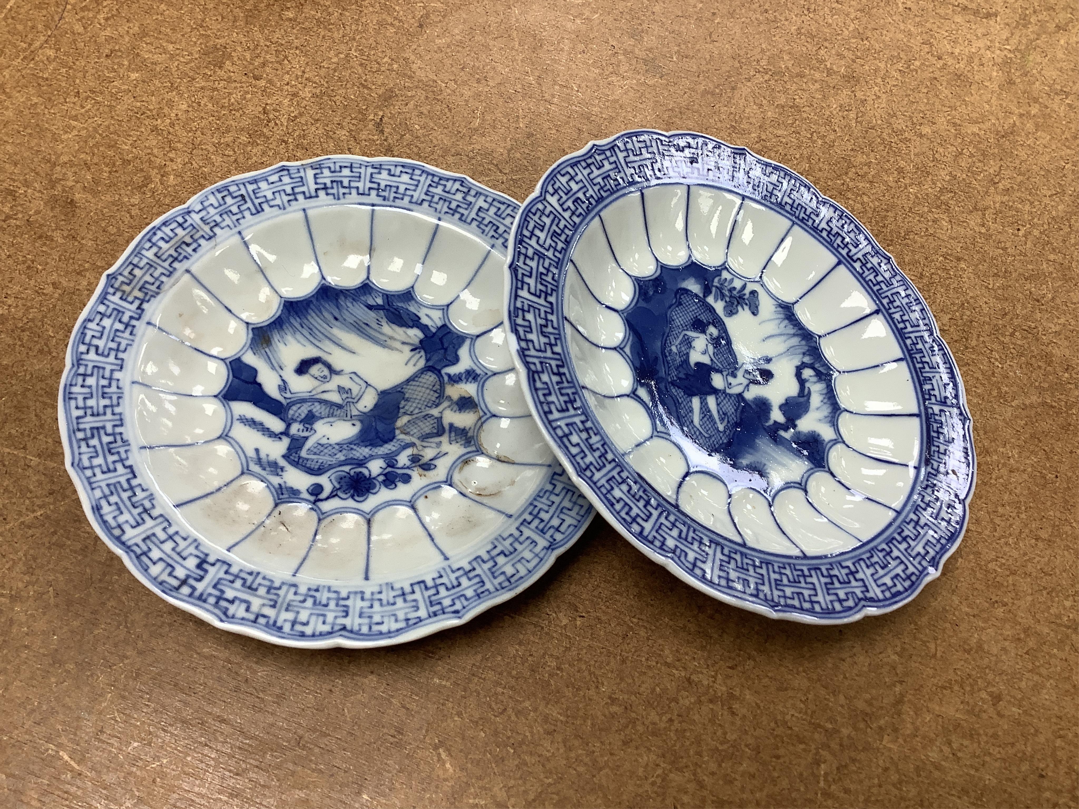 Two Chinese blue and white tea bowls and saucers, saucer 10cm diameter.